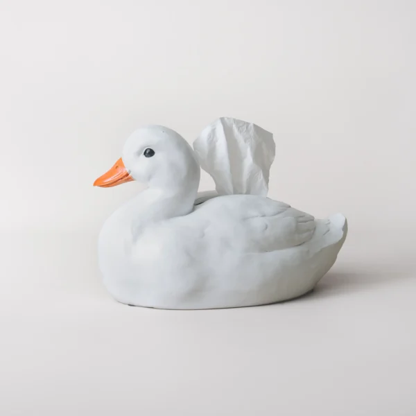 Boîte à mouchoirs originale représentant un canard assis, conçue pour égayer les coins repas ou les buffets familiaux.
