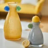 Idée originale pour décorer vase : formes arrondies colorées sur verre soufflé, parfait pour un coin déco éclatant.