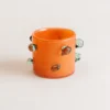 vase pour fleurs orange avec pois en relief
